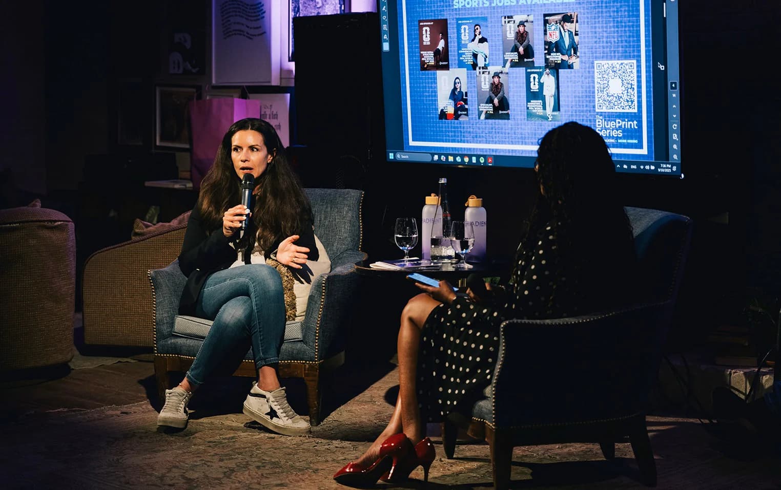 Speaker with a microphone at a Gradient fireside chat